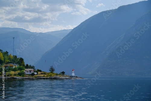 Coast with a lighthouse in  Hjelmeland. Durign trip by ferry from Nesvik to  in Norway. photo