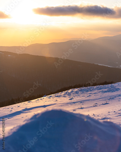 panorama of snowy mountains bieszczady at sunset, coniferous trees covered with snow, colorful winter sunset seen from the top of the mountain bukowe berdo photo