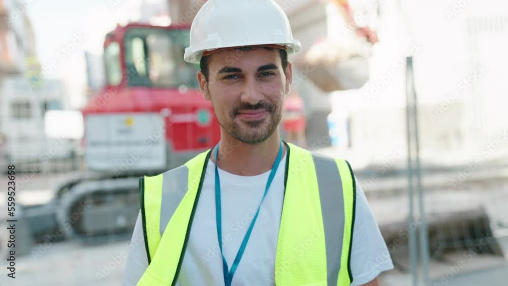 Young hispanic man architect smiling confident standing at street Young hispanic man architect smiling confident standing at street
