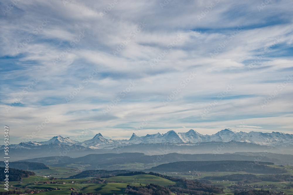 view of the bernese alps in Switzerland during a hazy day, copy space