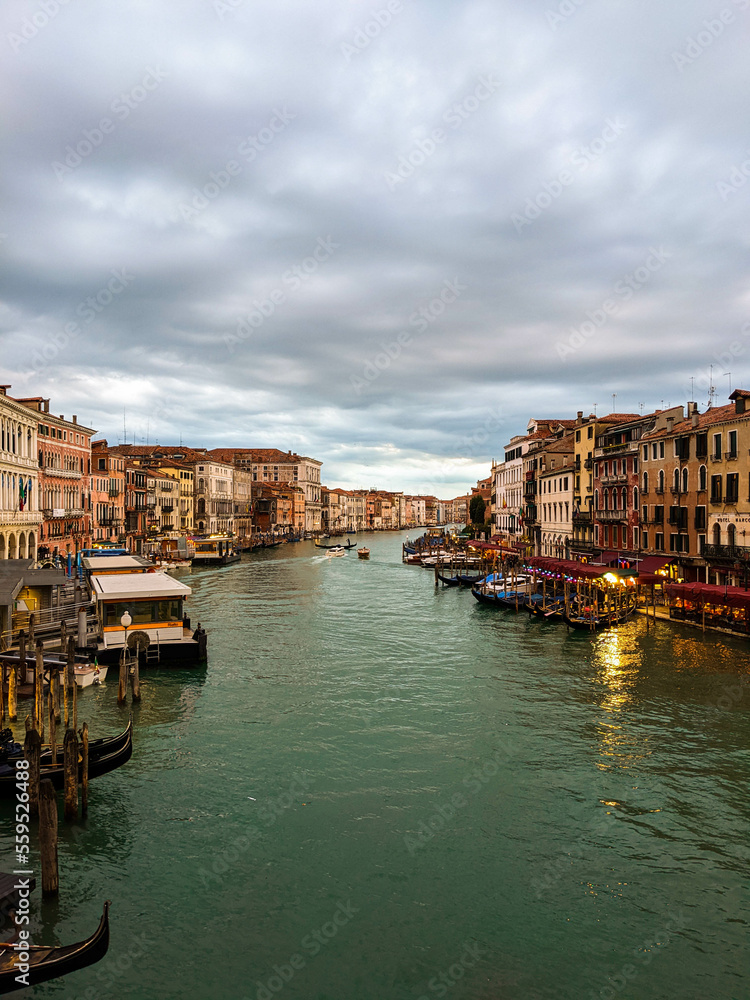 Romantic view of the Grand Canal in Venice. Characteristic houses, gondolas, tourism in Italy