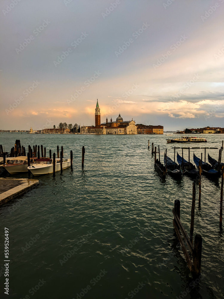 View of San Giorgio Maggiore island in Venetian Lagoon, sailing boats in Giudecca Canal. Venezia, Veneto