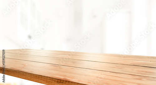 empty wooden table on background of abstract blur white interior, montage, product display, inside and window.