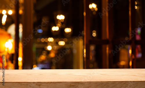 dark blurred background with empty table top, cafe restaurant windows. background for your product © Egor