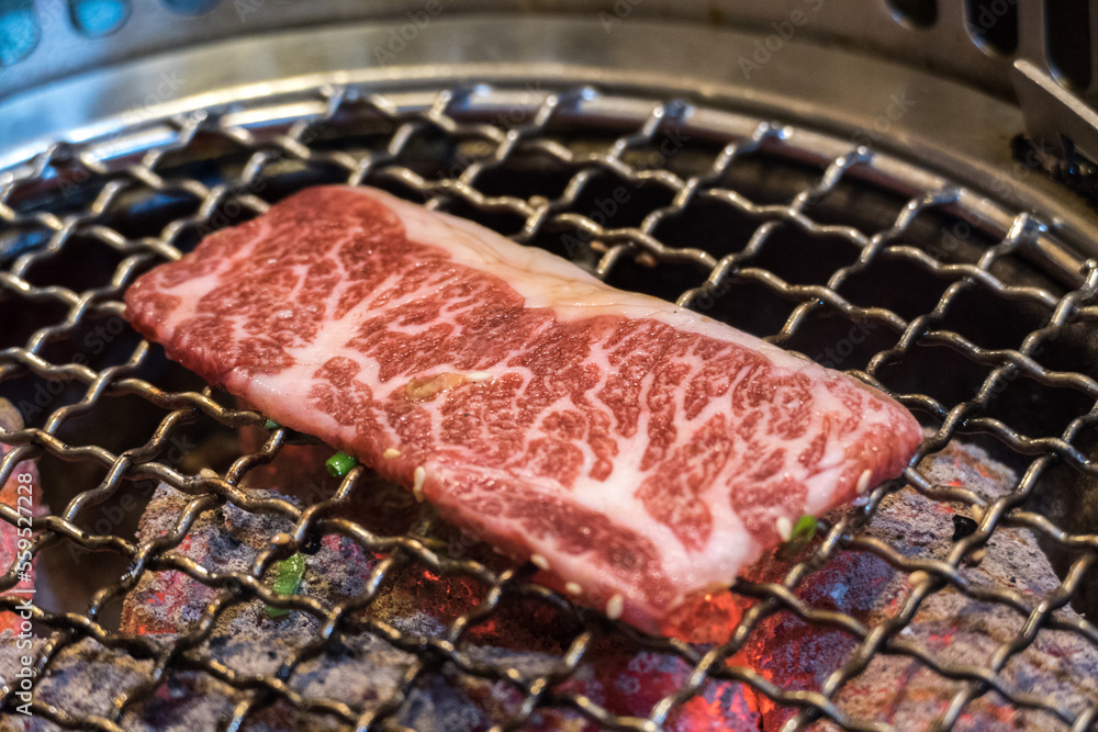 Japanese Wagyu Beef on BBQ charcoal grill stove Japanese Wagyu Beef on BBQ charcoal grill stove