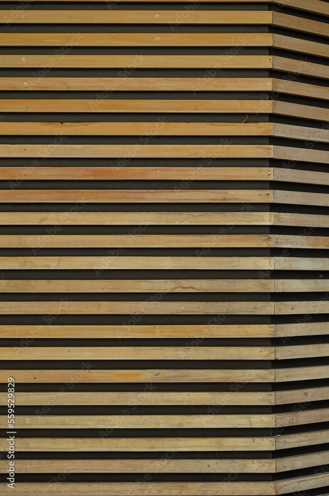Golden Oak Planking on a Black Stucco Wall. Golden Oak Planking on a Black Stucco Wall.