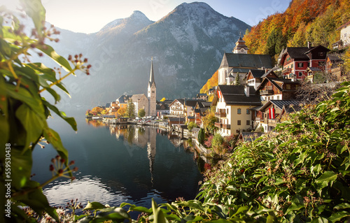 Amazing view of famous old town Hallstatt, Salzkammergut, Austria. Scenic nature landscape on a beautiful sunny day at sunrise in summer. Concept ideal resting place. Popular travel destination