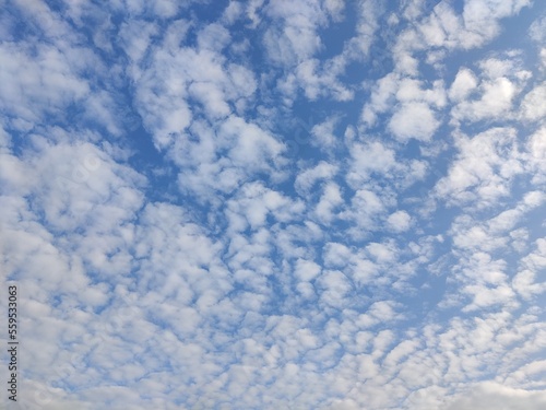 Picture of blue sky with white clouds in sky shot in the morning 