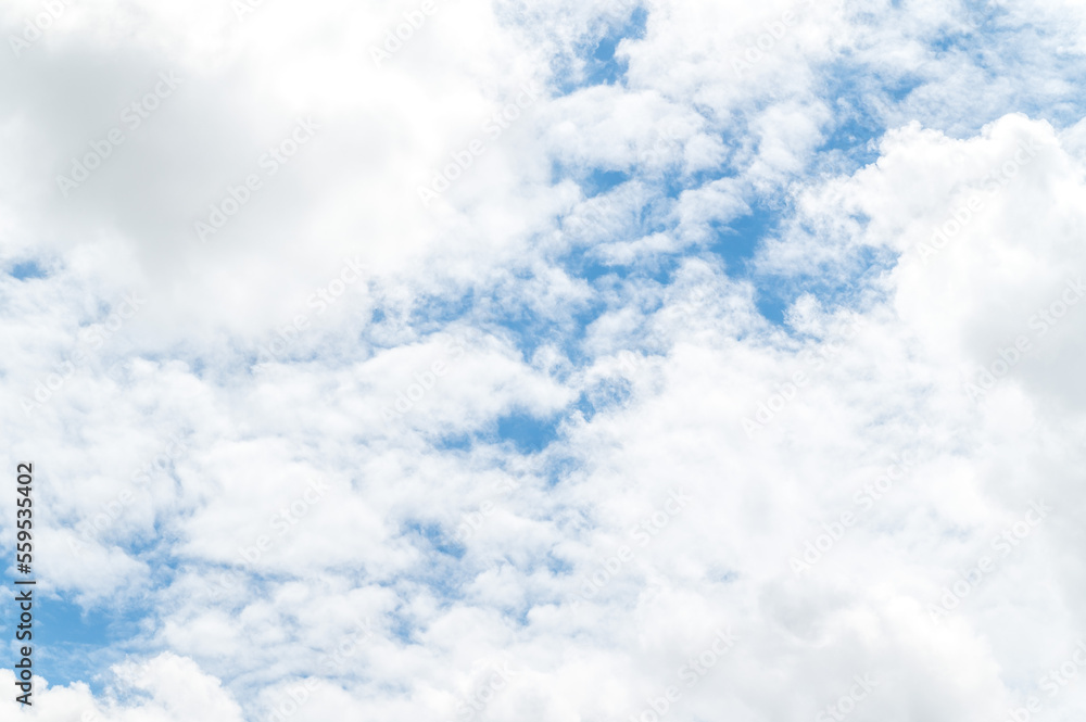 Beautiful white fluffy clouds in blue sky. Nature background from white clouds in sunny day Beautiful white fluffy clouds in blue sky. Nature background from white clouds in sunny day