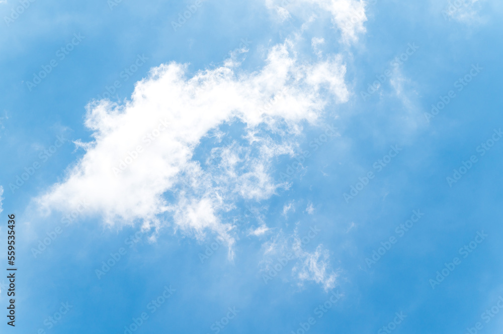 Obraz premium Beautiful white fluffy clouds in blue sky. Nature background from white clouds in sunny day