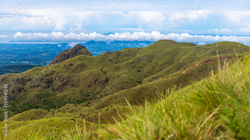 panorama of Costa Rica s cerro pelado mountains during a sunny day  mighty mountains covered with green  succulent grass  mountains in the tropics amidst rainforests