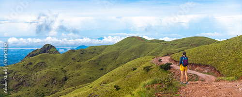 Canvas Print A backpacker girl admires the skyline of Costa Rica's cerro pelado mountains dur