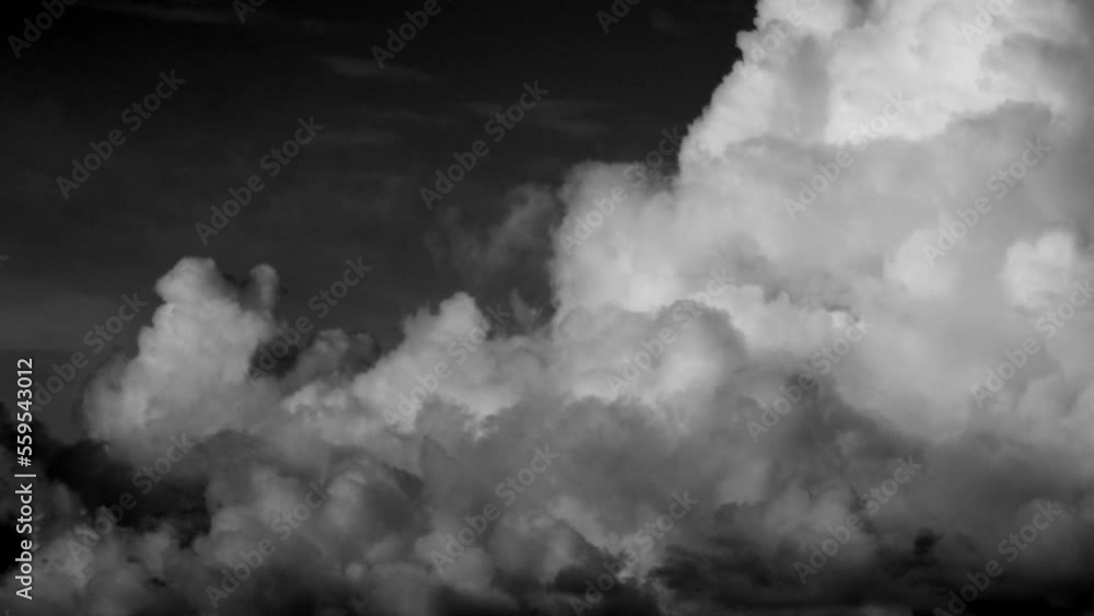 Beautiful background with clouds. Black and white time lapse. The calming current of clouds Beautiful background with clouds. Black and white time lapse. The calming current of clouds