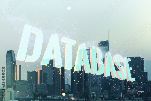 Double exposure of creative Database word hologram on Los Angeles city skyscrapers background, research and development concept
