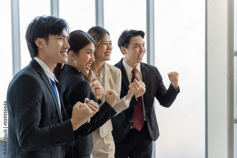 A group of young Asian businessmen Talking and planning work happily and have fun. at the company's office A group of young Asian businessmen Talking and planning work happily and have fun. at the company's office