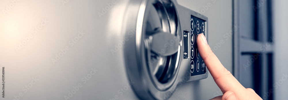 Woman opening steel safe with electronic lock, closeup. Banner design - obrazy, fototapety, plakaty 