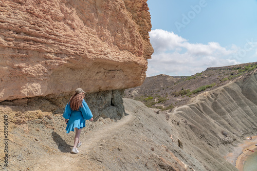 Woman hiking in nature in Malta between the rocks. 