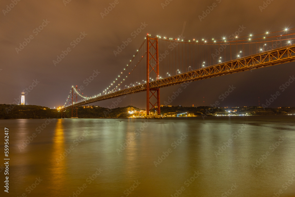 Long exposure photo of the 25th of April bridge in Lisbon, Portugal