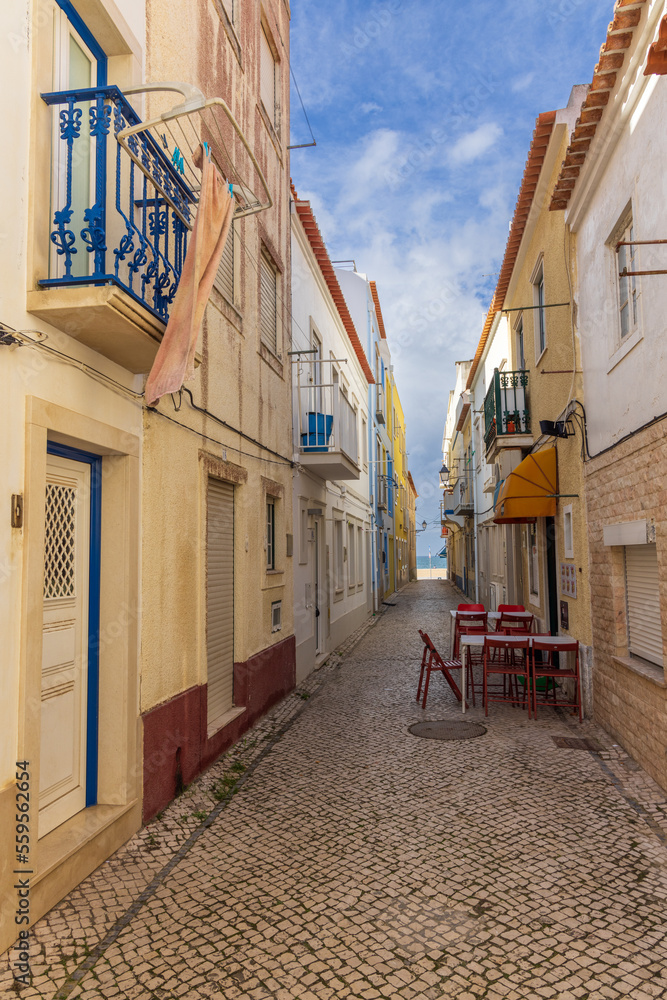 Narrow street leading to the beach in Nazaré, Portugal