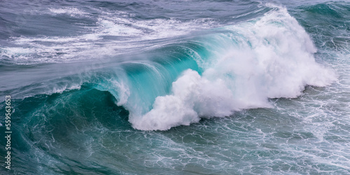 Panoramic photo of high breaking wave