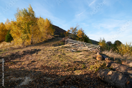 Old wooden gate on a hill