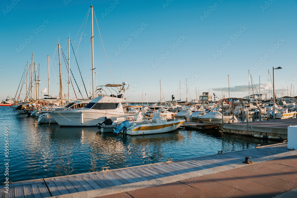 Small boats and yachts are anchored in the Port of Sant Carlos De La Rapita, Spain