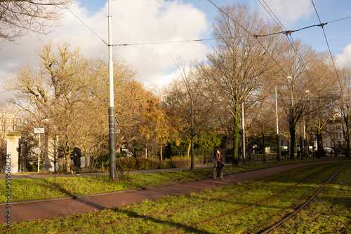 22 December 2022, Amsterdam: Green park in spring season. Streetcar track. 