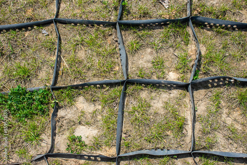Geogrid made of plastic and rubber to strengthen the land. The photo can be used in advertising, presentations. photo