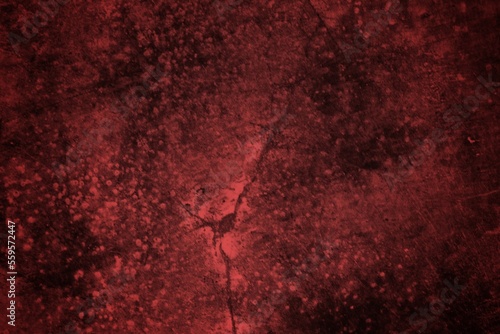 A textured background featuring deep red tones with a distressed, grunge appearance. The surface shows scratches and uneven patterns, creating a vintage feel.