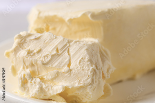 Tasty homemade butter on plate, closeup view