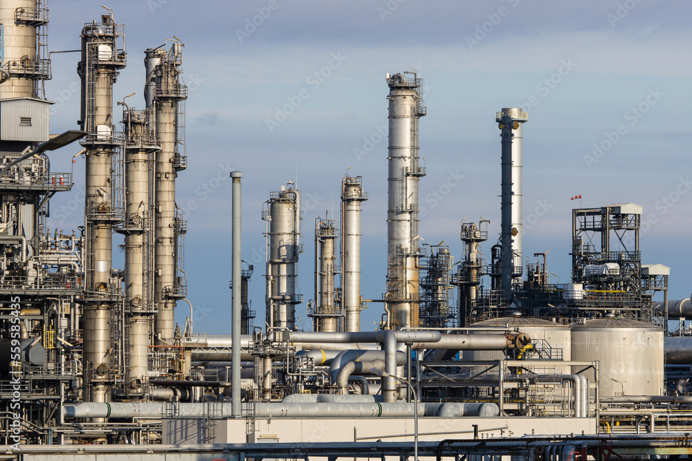 Industrial facility at a refinery with smokestacks for fuel production