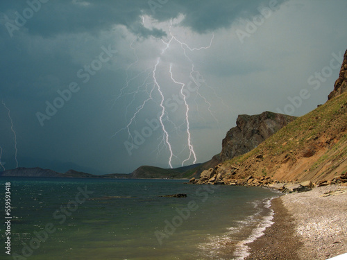 Lightning discharges over the Karadag mountain range. Crimea. The Black Sea coast. Near Feodosia and Koktebel