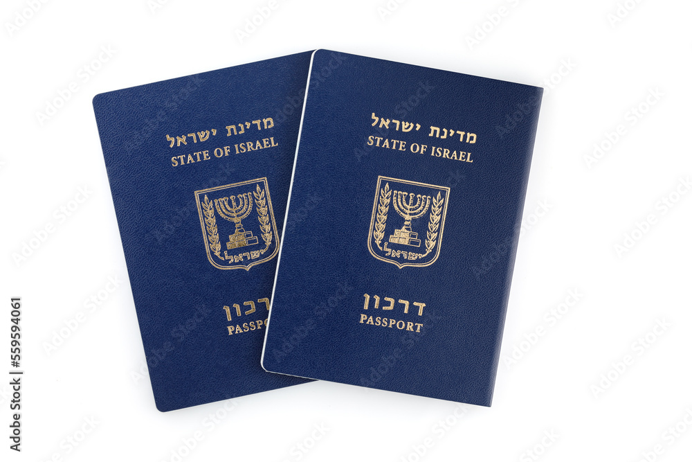 Two Israeli passports isolated on a white background. International Travel Identity Document. Close-up Two Israeli passports isolated on a white background. International Travel Identity Document. Close-up