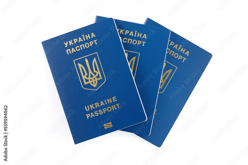 Ukrainian biometric foreign passports, isolated on white background. Inscription in Ukrainian Ukraine Passport. Close-up. Ukrainian biometric foreign passports, isolated on white background. Inscription in Ukrainian Ukraine Passport. Close-up.