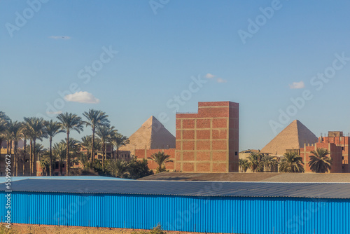 Pyramids behind buildings of Giza, Egypt