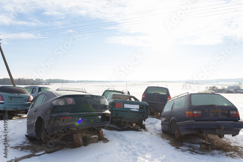 Disassembled cars on a car dump are on sale for spare parts.