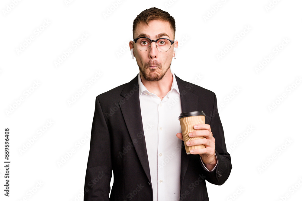 Young business caucasian man drinking a coffee isolated cutout shrugs shoulders and open eyes confused. Young business caucasian man drinking a coffee isolated cutout shrugs shoulders and open eyes confused.