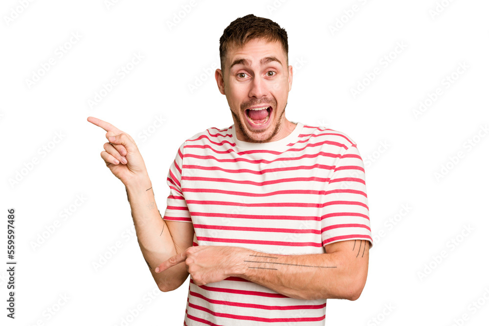 Young caucasian man cut out isolated excited pointing with forefingers away. Young caucasian man cut out isolated excited pointing with forefingers away.