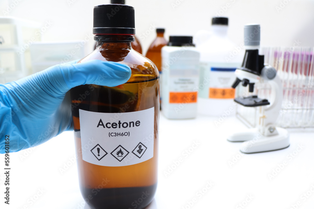 Acetone in bottle , chemical in the laboratory and industry Acetone in bottle , chemical in the laboratory and industry
