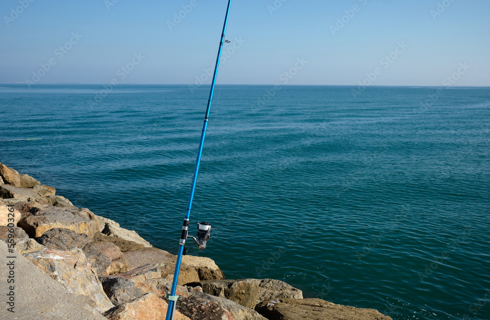 Fishing rods on the pier.
Fishing rods ready to catch fish and have a good time.
Fishing rods on the pier.
Fishing rods ready to catch fish and have a good time.