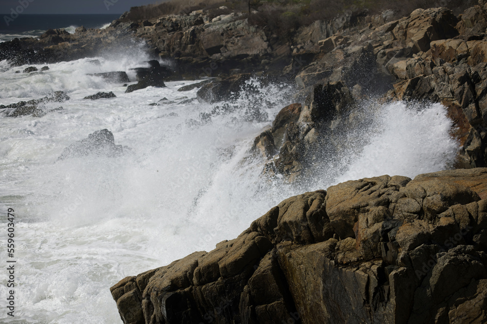 Ocean waves crashing against a rocky shore Ocean waves crashing against a rocky shore