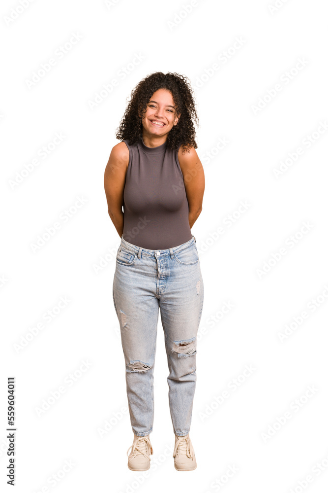 Young african american woman with curly hair cut out isolated happy, smiling and cheerful. Young african american woman with curly hair cut out isolated happy, smiling and cheerful.