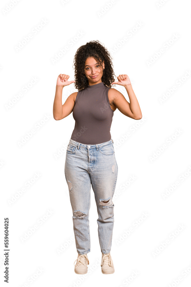 Young african american woman with curly hair cut out isolated feels proud and self confident, example to follow. Young african american woman with curly hair cut out isolated feels proud and self confident, example to follow.