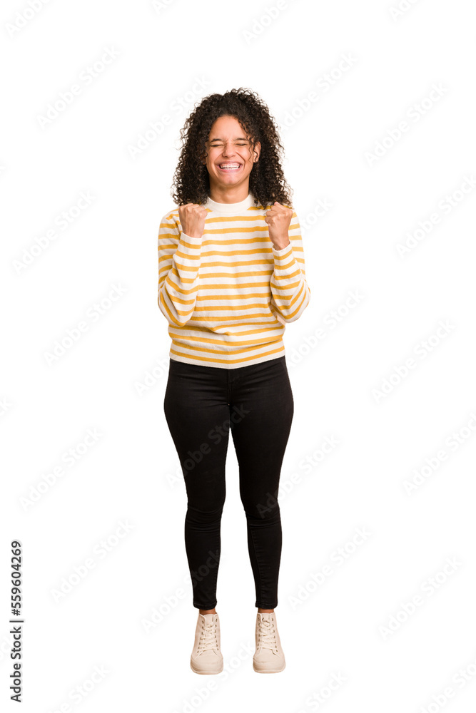 Young african american woman with curly hair cut out isolated cheering carefree and excited. Victory concept. Young african american woman with curly hair cut out isolated cheering carefree and excited. Victory concept.