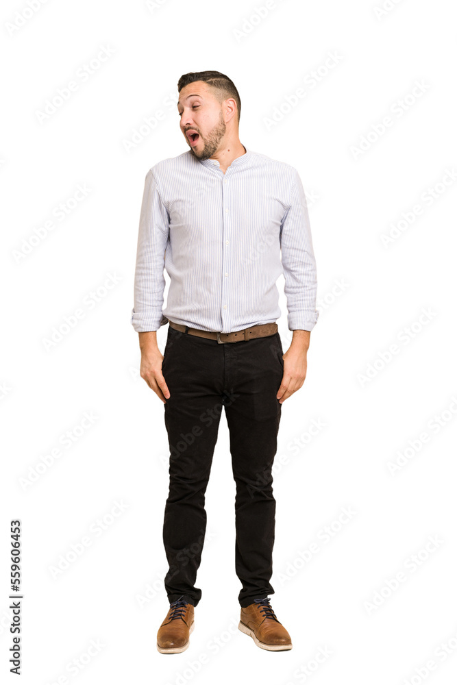 Full body adult latin man cut out isolated looks aside smiling, cheerful and pleasant. Full body adult latin man cut out isolated looks aside smiling, cheerful and pleasant.