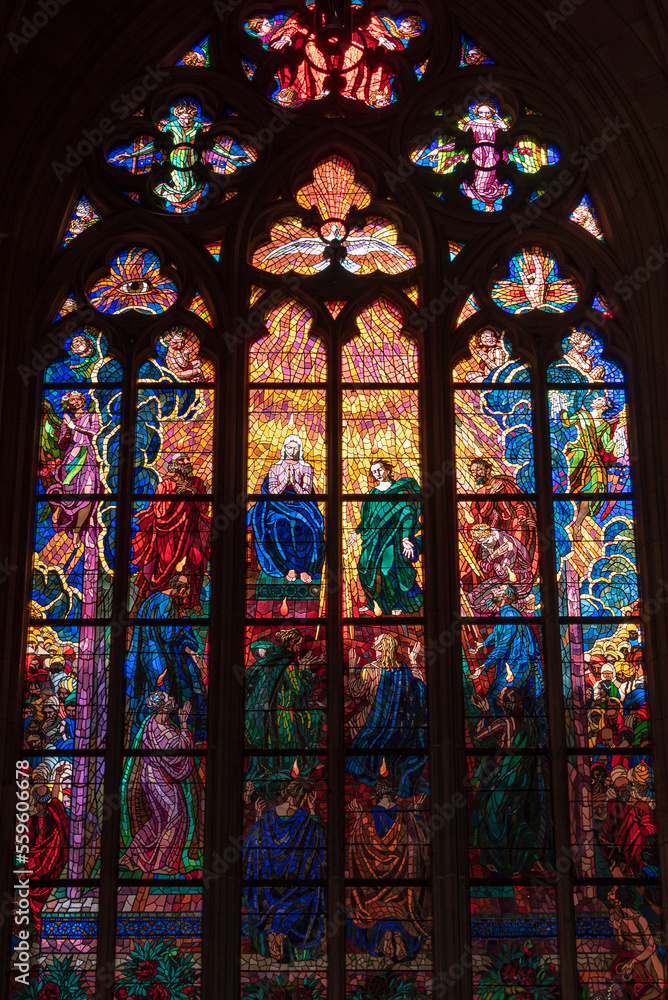 A medieval stained glass window in St. Vitus Cathedral in Prague