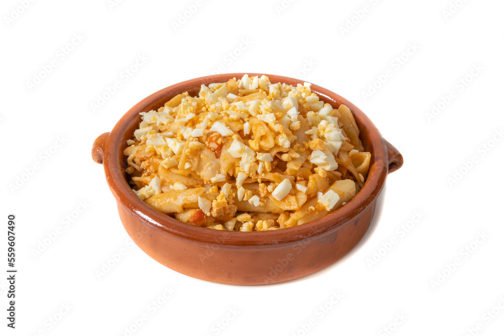 A clay bowl with macaroni, topped with chopped hard-boiled egg. Isolated on white background. For menu card. A clay bowl with macaroni, topped with chopped hard-boiled egg. Isolated on white background. For menu card.