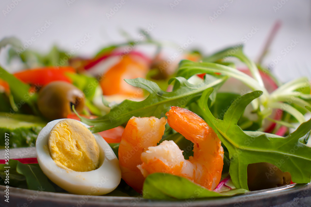 Salad with shrimps, tomatoes in a plate Salad with shrimps, tomatoes in a plate
