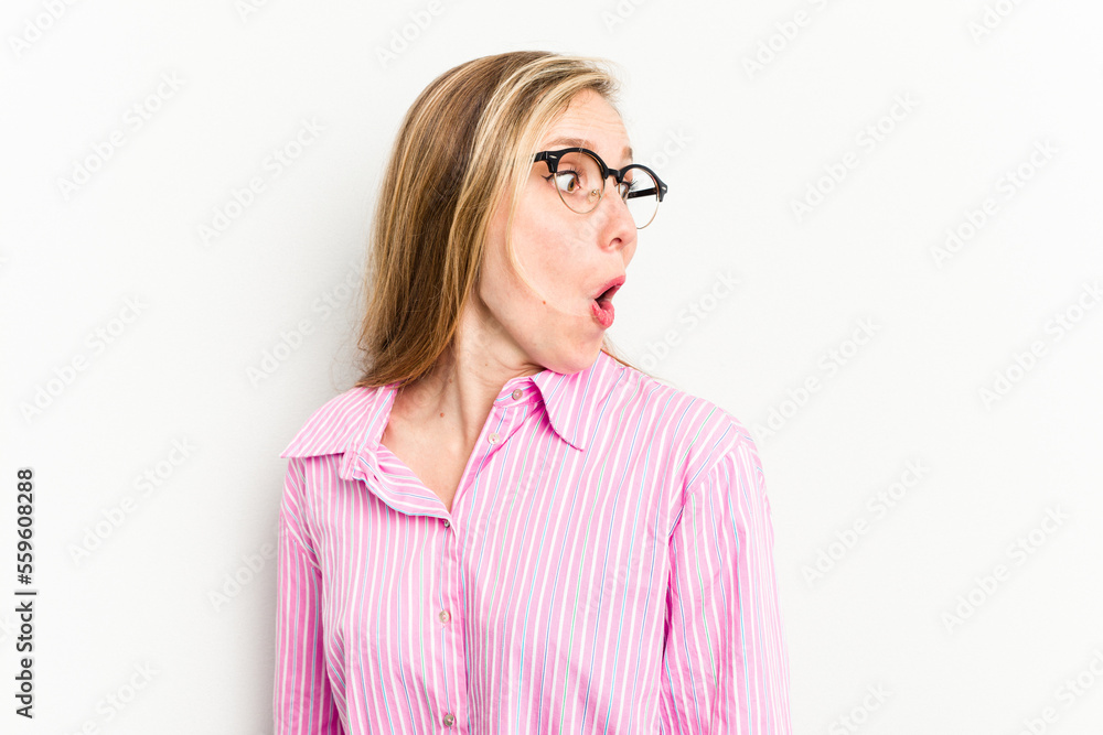 Young caucasian woman isolated on white background looks aside smiling, cheerful and pleasant. Young caucasian woman isolated on white background looks aside smiling, cheerful and pleasant.