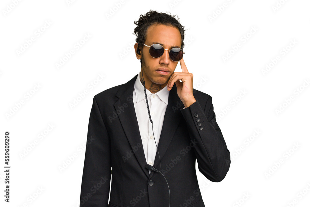 Young African American bodyguard man isolated pointing temple with finger, thinking, focused on a task. Young African American bodyguard man isolated pointing temple with finger, thinking, focused on a task.
